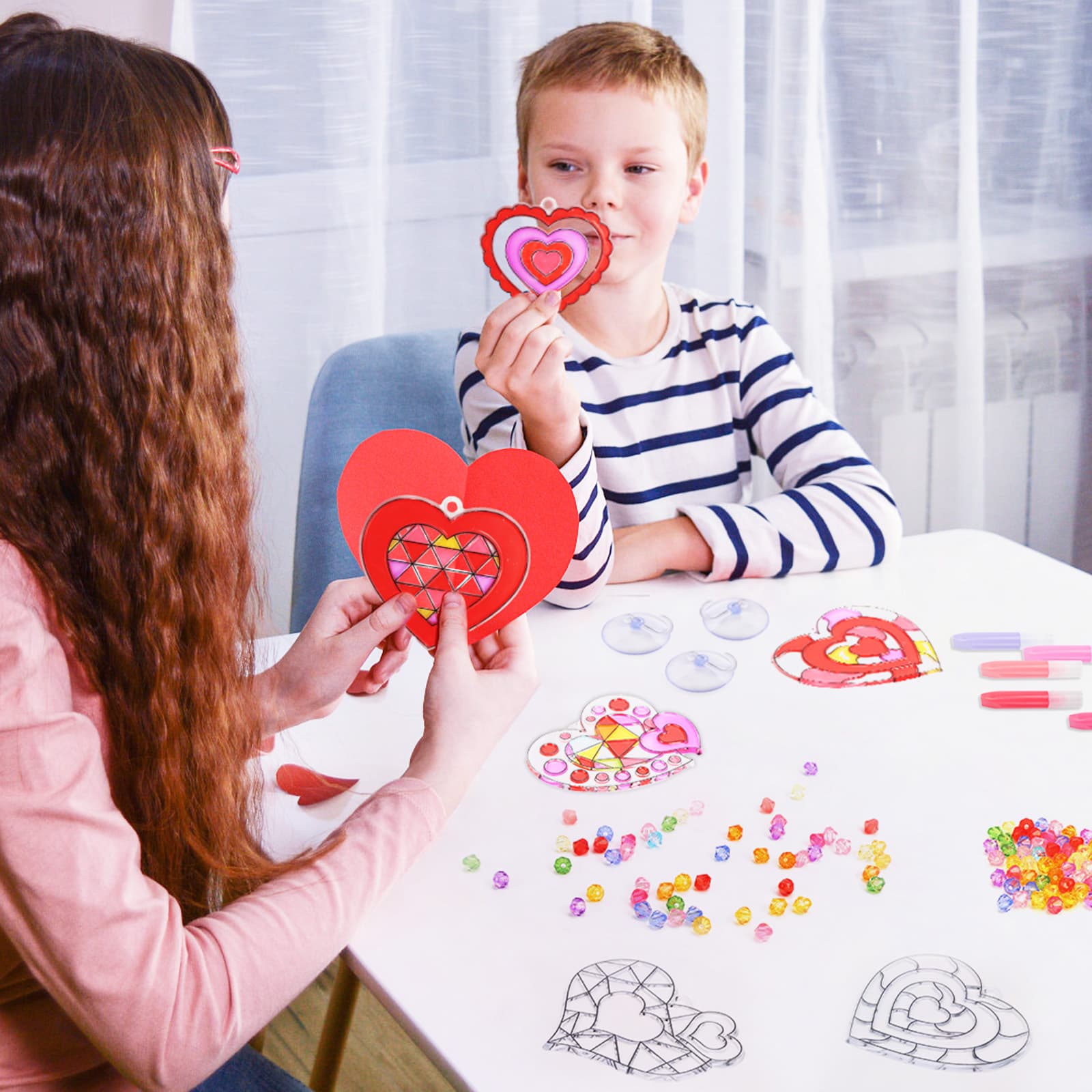 24-piece set of heart shaped adhesive panels in various designs.