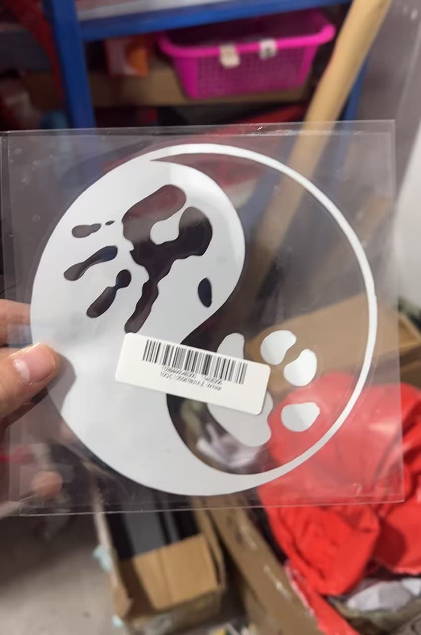 Yin Yang design featuring a cat and dog paw print sticker
